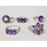 FIVE SILVER AND PURPLE STONE RINGS OF VARIOUS DESIGNS STAMPED SIZES P R 1/2 AND T 1/2 17G GROSS