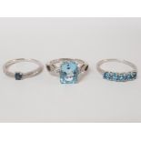 THREE SILVER AND BLUE STONE RINGS STAMPED SIZES P 1/2 AND S 8.5G GROSS