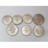 7 SILVER COINS INCLUDES 3 SILVER HALF CROWNS DATED 1940, 1942 AND 1945 ALSO INCLUDES FLORINS DATED