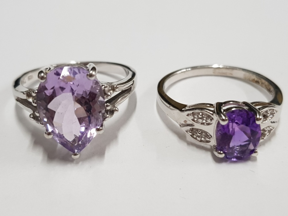 TWO SILVER AND PURPLE STONE RINGS STAMPED SIZE R 1/2 7G GROSS