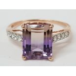 A 9CT ROSE GOLD PURPLE AND WHITE STONE RING T 1/2 3.5G GROSS