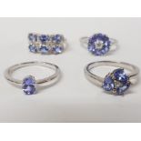 FOUR SILVER AND BLUE STONE RINGS STAMPED SIZES R AND T 14.3G GROSS