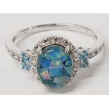 A SILVER DOUBLET OPAL BLUE AND WHITE STONE RING STAMPED SIZE U 2.6G GROSS
