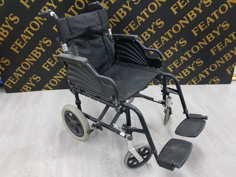 A BLACK FOLDING WHEELCHAIR