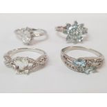 FOUR SILVER AND PALE BLUE STONE RINGS STAMPED SIZES R R 1/2 AND T 1/2 13.9 G GROSS