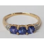 A 9CT YELLOW GOLD BLUE STONE AND DIAMOND RING SIZE U 2.7G GROSS