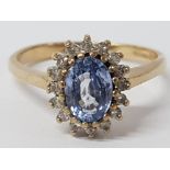 9CT YELLOW GOLD OVAL PURPLE STONE AND DIAMOND CLUSTER RING, 1.9G GROSS SIZE N