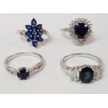 FOUR SILVER AND BLUE STONE RINGS STAMPED SIZES R 1/2 AND S 15.4G GROSS
