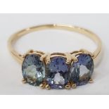 A 9CT YELLOW GOLD AND BLUE STONE RING T 1/2 1.9G GROSS