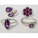 FOUR SILVER AND PURPLE STONE RINGS STAMPED SIZES R 1/2 T 1/2 AND U 15.8G GROSS