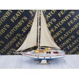 A WOODEN MODEL OF A YACHT ON STAND 122CM HIGH