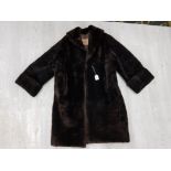 A LADIES BROWN BEAVER FUR 3/4 LENGTH COAT BY CLAREMURE OF LONDON SIZE 12 APPROX