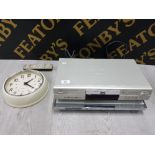 PANASONIC DVD PLAYER, LG DIGITAL VERSITILE DISK PLAYER AND A QUARTZ WALL CLOCK