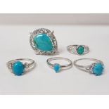 FIVE SILVER AND TURQUOISE RINGS STAMPED SIZES R 1/2 S AND U 19.9G GROSS