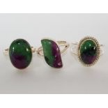 THREE SILVER GREEN AND PURPLE HARDSTONE RINGS STAMPED SIZES P 1/2 AND T 1/2