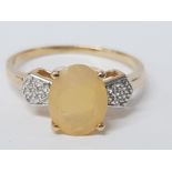 A 9CT YELLOW GOLD OPAL AND WHITE STONE RING SIZE T 1/2 2.8G GROSS