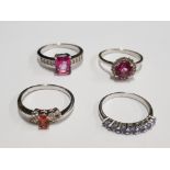 FOUR SILVER PINK ORANGE AND PURPLE STONE RINGS STAMPED SIZES R 1/2 T 1/2 AND U 12.7G GROSS