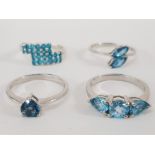 FOUR SILVER AND BLUE STONE RINGS STAMPED SIZES R R 1/2 AND S 11G GROSS