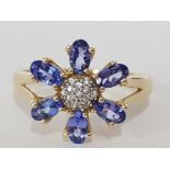 A 9CT YELLOW GOLD PURPLE AND WHITE STONE RING T 1/2 1.9G GROSS