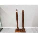 A PAIR OF EARLY 20TH CENTURY OAK STANDARD LAMPS ON THE FORM OF COLUMNS 127CM