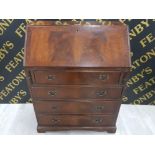 A REPRODUCTION MAHOGANY BUREAU RAISED ON BRACKET FEET 75 X 99 X 43CM