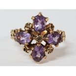 9CT YELLOW GOLD PURPLE STONE CLUSTER RING, 3.7G SIZE O