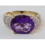 9CT YELLOW GOLD OVAL AMETHYST AND DIAMOND RING, 3.9G SIZE O