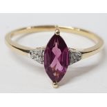 A 9CT YELLOW GOLD AND PURPLE STONE RING SIZE R 1/2 1.7G GROSS