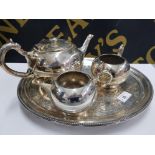 THREE PIECE SILVER ON BRITANNIA METAL BULLET SHAPED TEA SET BY WALKER AND HALL ON FOOTED ANTIQUE