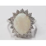 LADIES 18CT WHITE GOLD OPAL AND DIAMOND CLUSTER RING COMPRISING OF A SINGLE OVAL CUT, OPAL