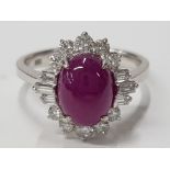 LADIES 14CT WHITE GOLD CABOCHON RUBY AND DIAMOND CLUSTER RING COMPRISING OF A SINGLE OVAL CUT