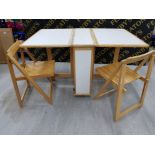 A DROP LEAF WOOD AND LAMINATE OUTSIDE FOLDING TABLE WITH TWO FOLDING CHAIRS TABLE 136 X 74 X 86