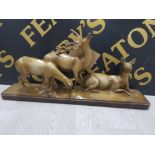 A PAINTED PLASTER SCULPTURE OF A STAG AND TWO DEER SIGNED S BONI PARIS 9.1.92 57.5CM LONG