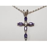 SILVER CRUCIFIX WITH FIVE CUT AMETHYSTS AND ONE CLEAR STONE ON 18" SILVER FINE CHAIN