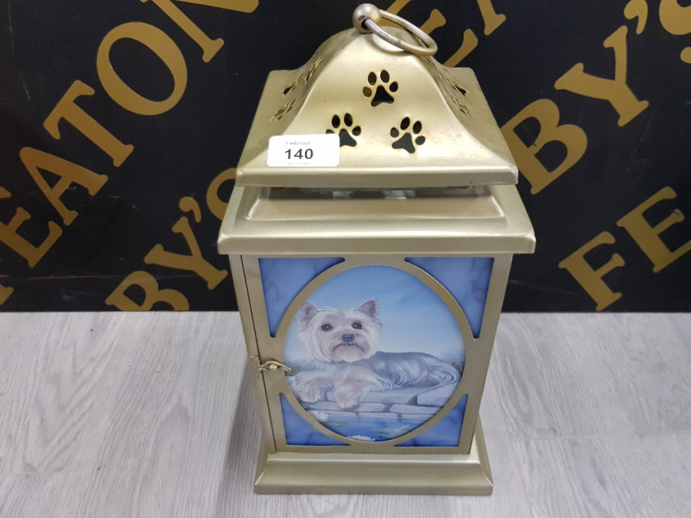 A MODERN LANTERN WITH YORKSHIRE TERRIER PANELS AND PAW PRINT PIERCED DECORATION 35CM HIGH