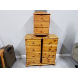 A PAIR OF TALL PINE BEDSIDE DRAWERS 47 X 95 X 40CM TOGETHER WITH A SMALLER ONE