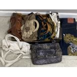 10 LADIES HAND BAGS AND PAIR OF EVISU JEANS SIZE 34