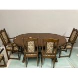 AN OAK EXTENDING DINING TABLE BY OLD CHARM TOGETHER WITH TWO CARVERS AND FOUR SINGLES