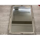 A MODERN BEVELLED WALL MIRROR WITH SILVER ORNATE FRAME 105 X 73CM