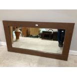 A MODERN RECTANGULAR WALL MIRROR IN LEATHER EFFECT FRAME 70 X 130CM