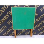 A SMALL FOLDING CARD TABLE WITH GREEN BAISE