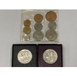 1953 CORONATION UNCIRCULATED COIN SET IN PLASTIC SLEEVE TOGETHER WITH TWO 1951 FESTIVAL CROWNS IN