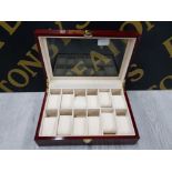 A MODERN LAMINATE WATCH DISPLAY CASE WITH TWELVE COMPARTMENTS