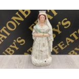 A LARGE 19TH CENTURY STAFFORDSHIRE FIGURE OF QUEEN VICTORIA IN HER WEDDING DRESS 44CM HIGH