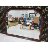 A REPRODUCTION MAHOGANY EFFECT BEVELLED OVER MANTLE MIRROR WITH DOUBLE CANTED CORNERS 103 X 137CM