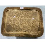A MIDDLE EASTERN BRASS RECTANGULAR TRAY 44.5CM LONG