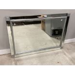 A MODERN BEVELLED GLASS WALL MIRROR WITH BEVELLED GLASS FRAME 74 X 104