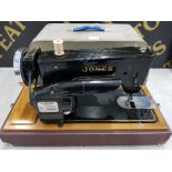 A VINTAGE JONES THREADLITE A1 SEWING MACHINE CASED