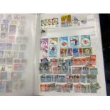 ALBUM CONTAINING A SUBSTANTIAL AMOUNT OF POSTAGE STAMPS INCLUDES WINTER OLYMPICS, ITALIAN, SPANISH