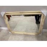 A MODERN RECTANGULAR WALL MIRROR IN CREAM SWEPT FRAME 75 X 105CM